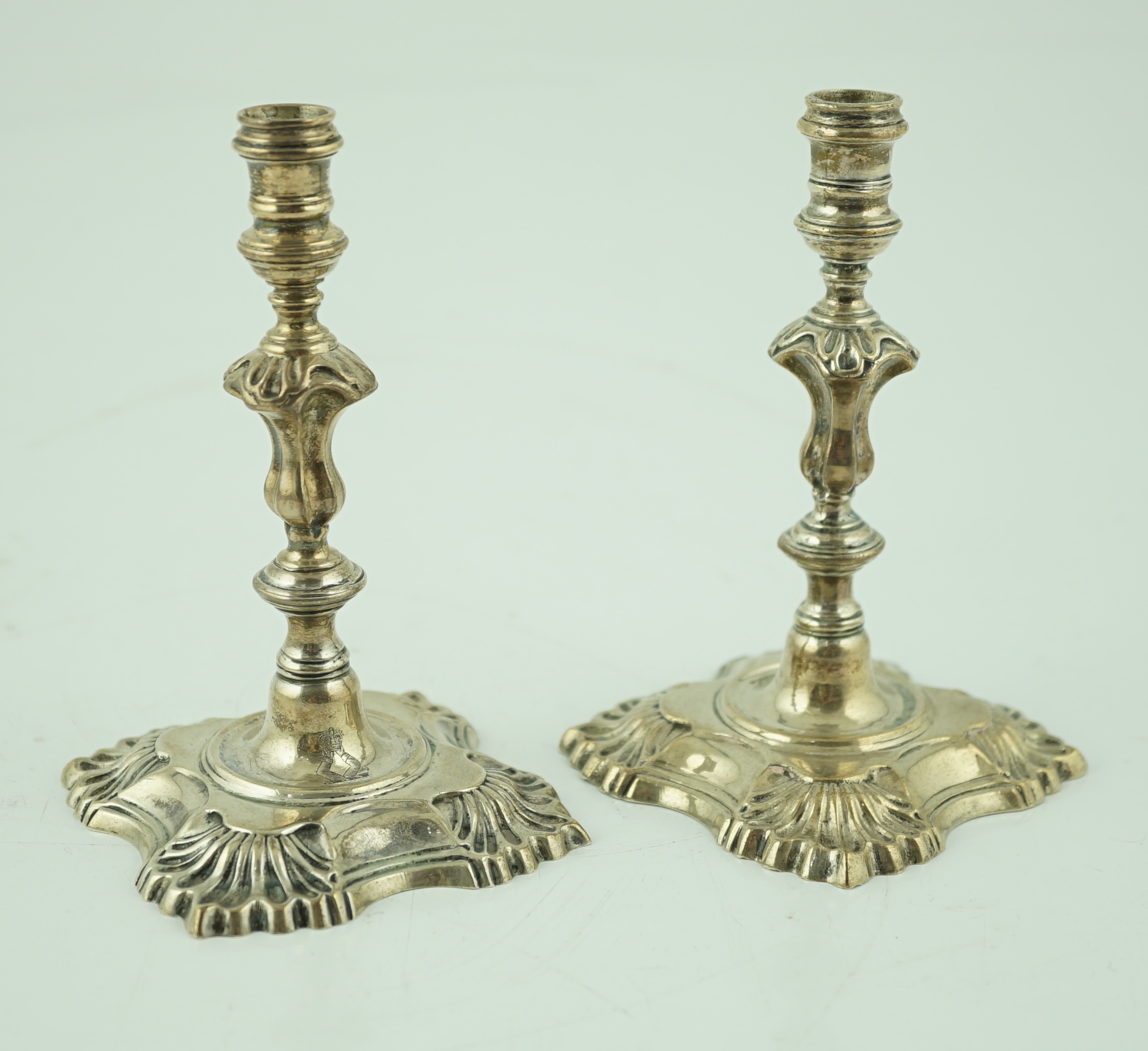 A pair of George V silver tapersticks by Sebastian Garrard for Garrards